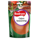 Bodrum - Cajun Seasoning - 100g comes in a resealable pouch with spice and food images, adding authentic Cajun taste and smoky flavor to your favorite dishes.